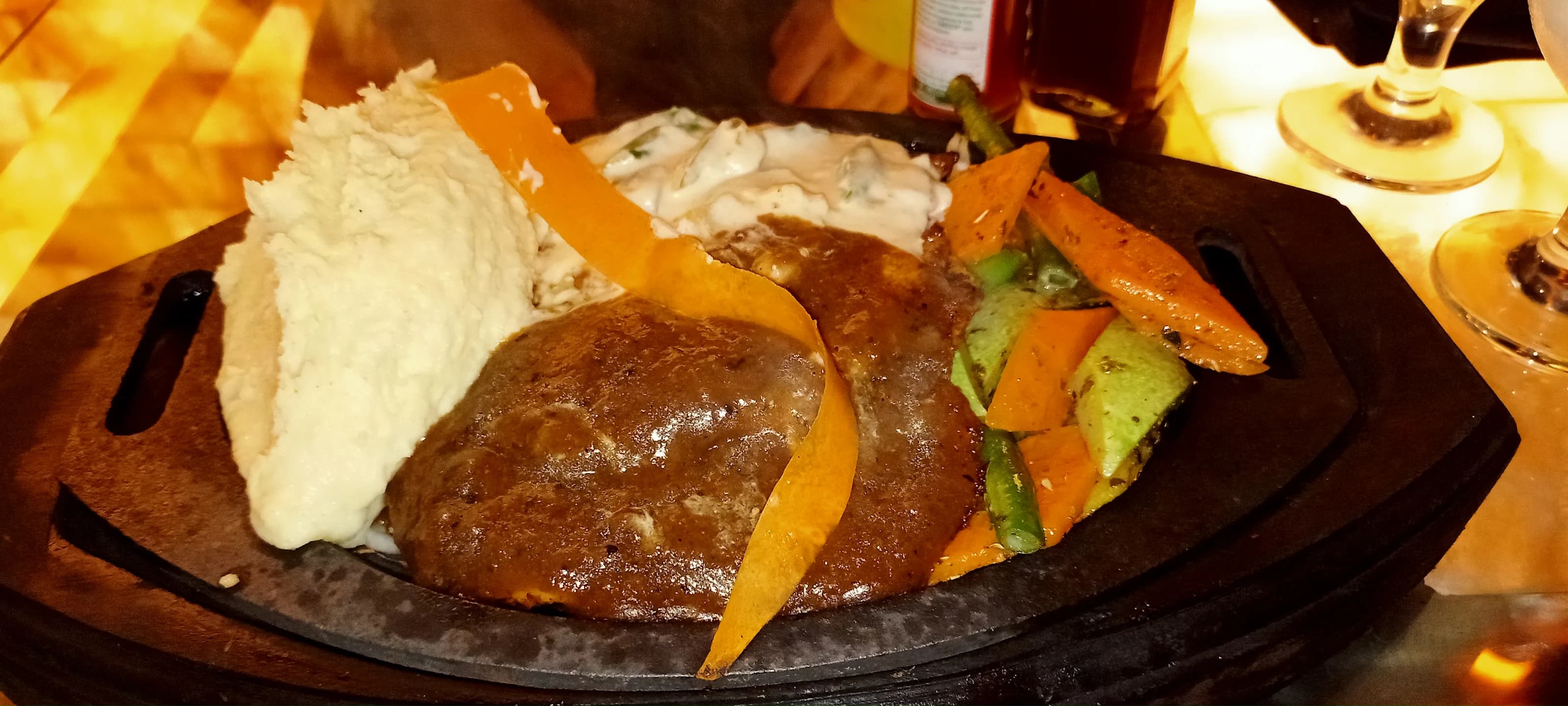 Prime beef deck steak cooked with cracked black pepper sauce at Fire n Steakhouse Rawalpindi