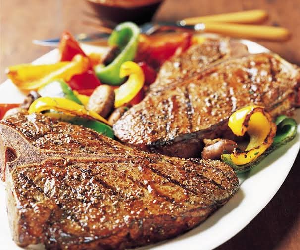 Juicy T-Bone steak with tenderloin and strip loin at Fire n Steakhouse Bahria Town Phase 7