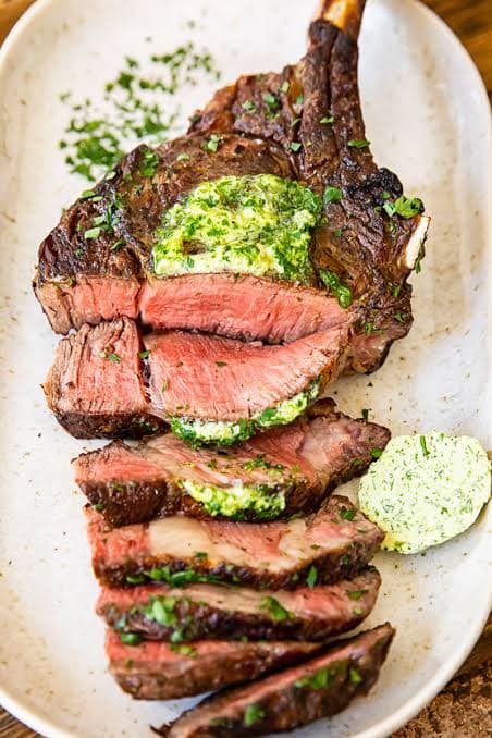 Massive Tomahawk ribeye steak on Himalayan salt block at Fire n Steakhouse Bahria Town Rawalpindi