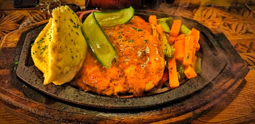 Fire Special Signature Steak cooked live on a 500°F Himalayan salt rock block at Fire n Steakhouse Bahria Town Phase 7