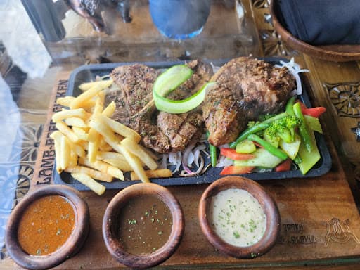Pan-seared beef steak with rich creamy tarragon herb sauce at Fire n Steakhouse Rawalpindi